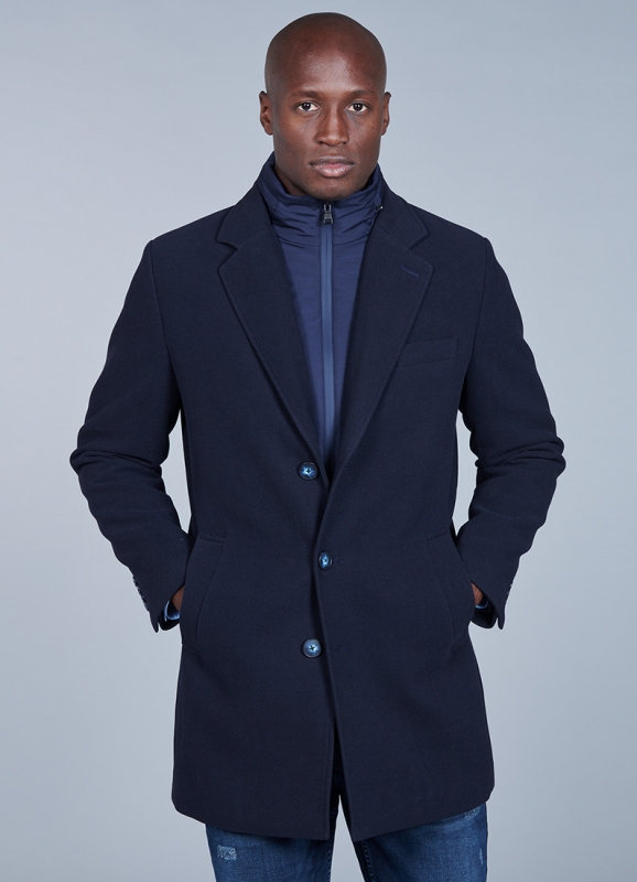 Coat with removable facing and tailored collar