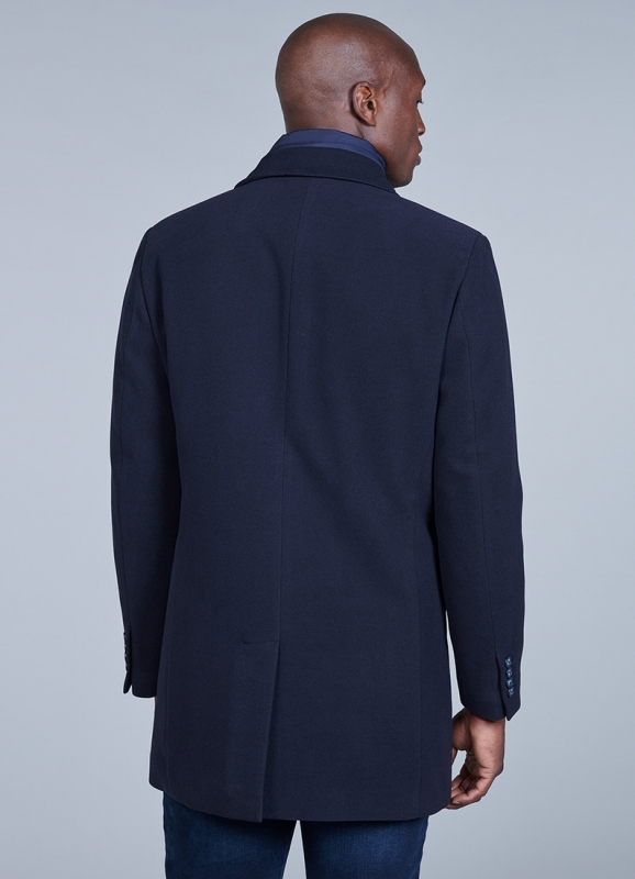 Coat with removable facing and tailored collar